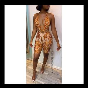 Stunning custom made halter jumpsuit. Front details orange/gold sequins, sz M/L.